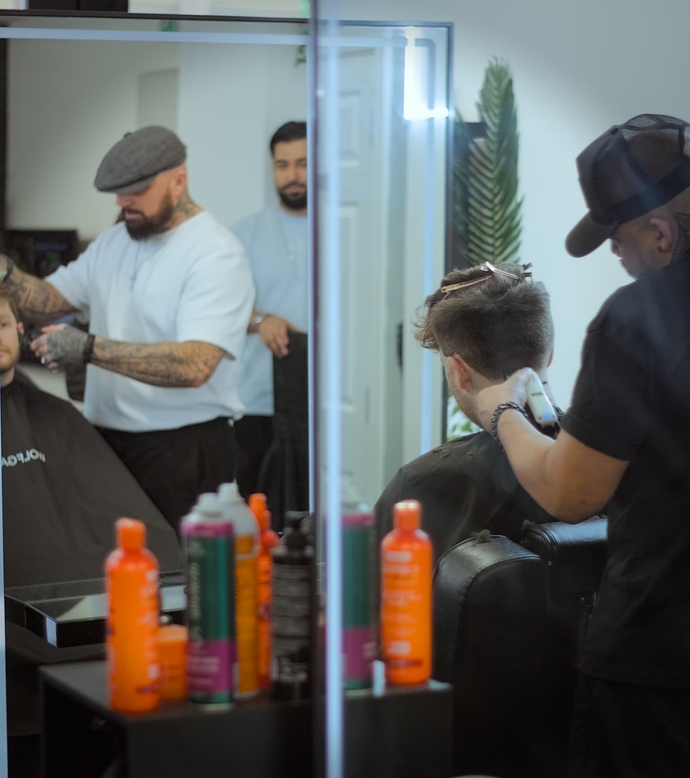 Two barbers at work in Wolfgang Hair Leicester